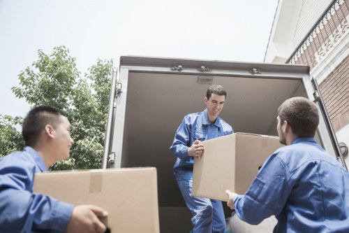 Local man and van team transporting household boxes and furniture