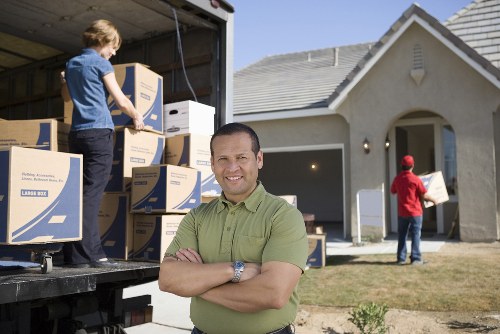 Removal van and moving team helping with a home move in South Woodford