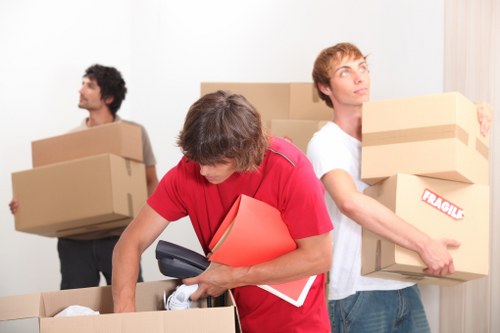 Packed moving boxes and furniture ready for collection