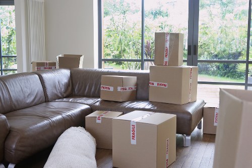 Loading furniture into a removal truck near South Woodford