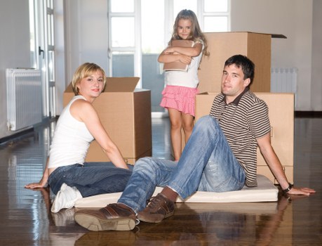 Packed moving boxes and furniture ready for local removals
